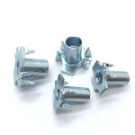 Steel tee nuts with prongs for secure fastening in mechanical assemblies.