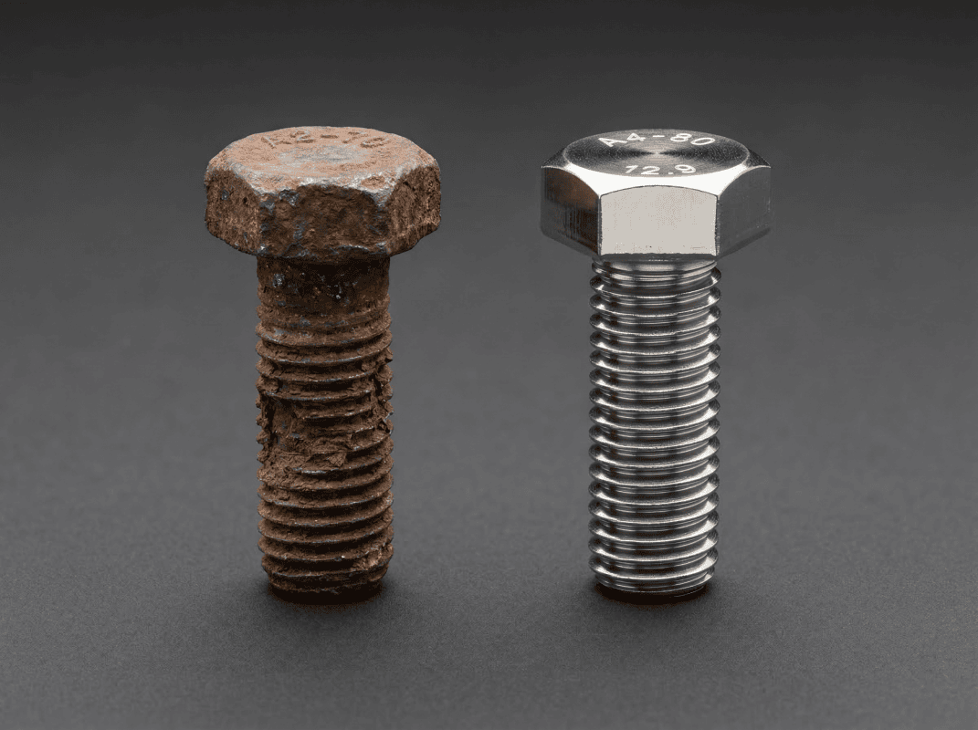 Rusty bolt with corrosion on left, new stainless steel bolt on right.