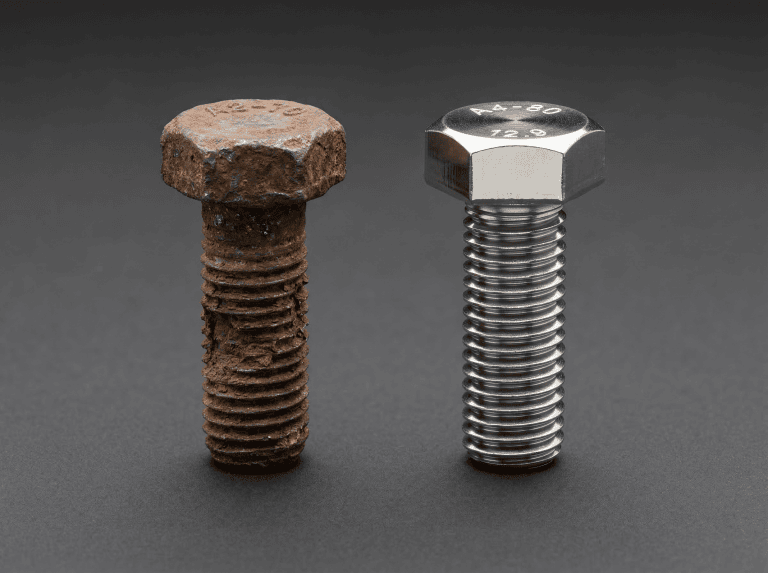 Rusty bolt with corrosion on left, new stainless steel bolt on right.